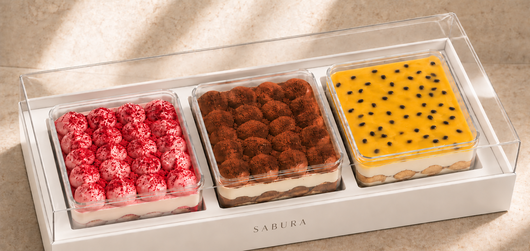 Three larger 10 oz SABURA Signature Cups in a white fitted presentation tray with a clear cover
